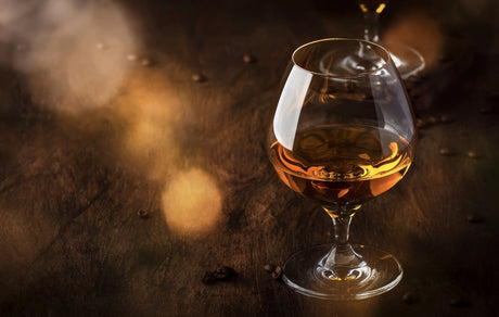 Brandy in a glass. Armagnac, Cognac and Calvados, french brandy. Aged in a barrel in France.