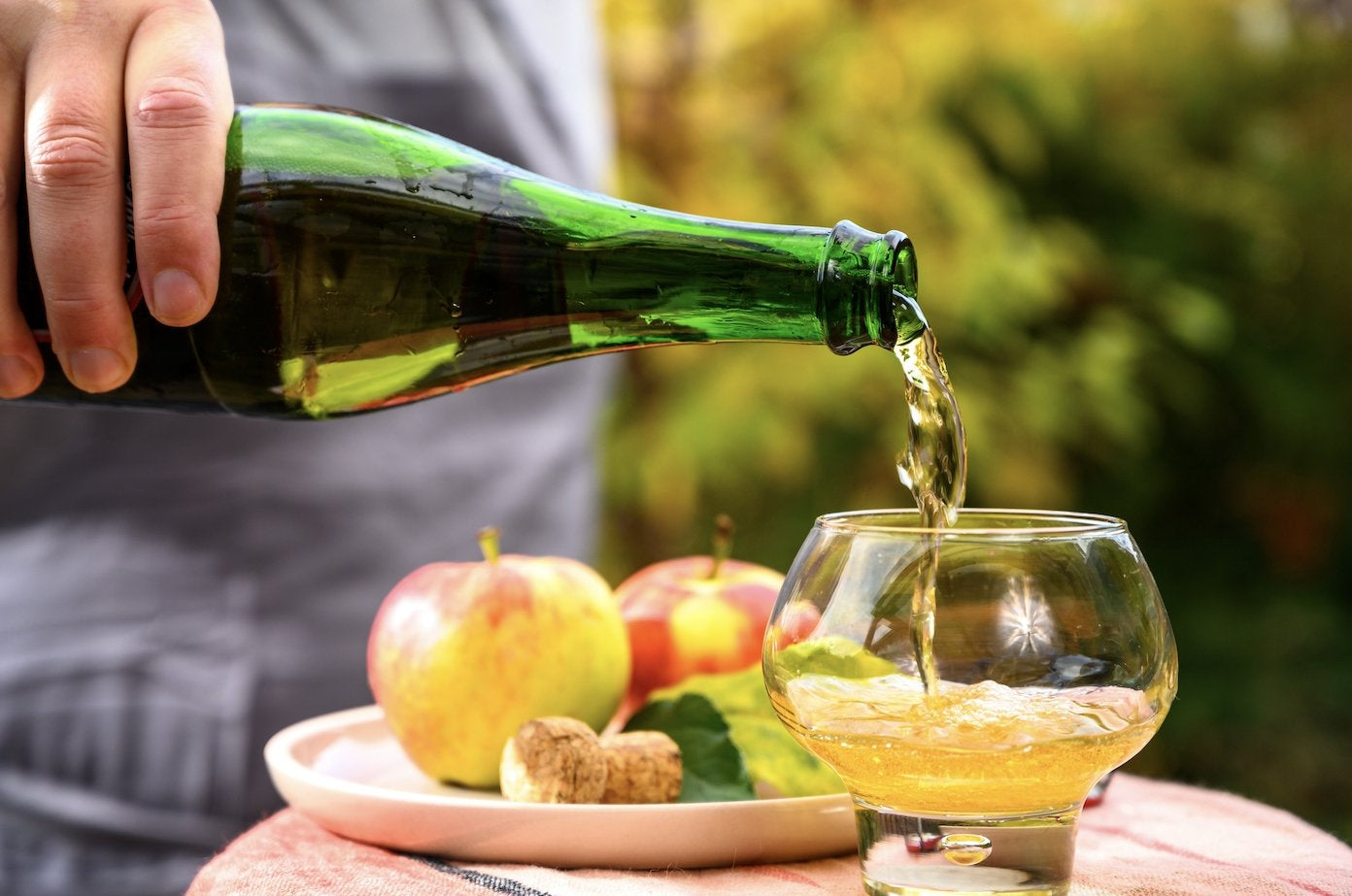 French Cider being poured into a glass. Apply cider from france. Spirits from france