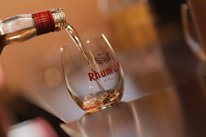 Rum being poured into a glass. JM Rhum from Martinique. Used in a Ti Punch cocktail. 